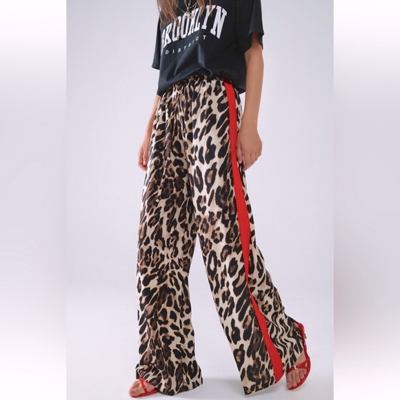 ShopEvelynne Pants - ✨RESTOCKED✨FROM PARIS FRANCE 🇫🇷 Leopard pants with red stripes down the sides.